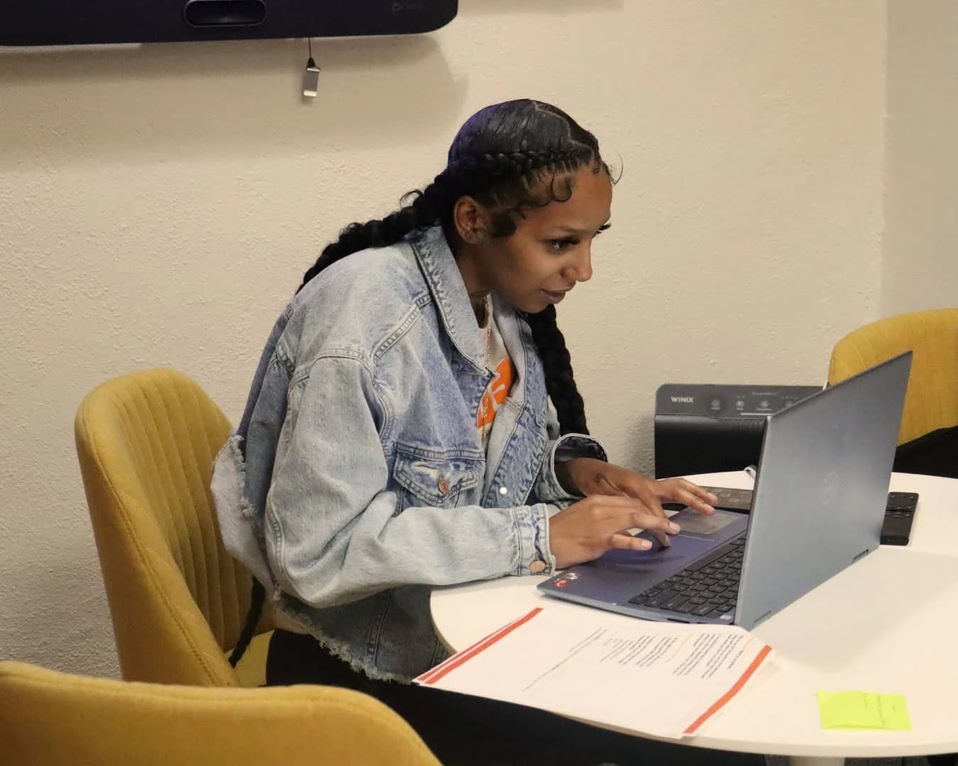 A participant working at a laptop.